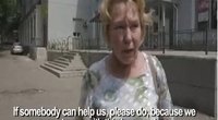 Donecko gyventoja: jeigu galite, padėkite mums, nes mes patys su tuo kovoti negalime  (nuotr. YouTube)