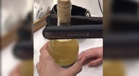 Parodė, kaip atidaryti butelį be kamščiatraukio: moters triukas plinta žaibiškai (nuotr. stop kadras)