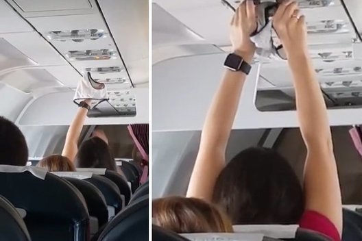 Lėktuvo keleiviai nepatikėjo akimis – moteris 20 minučių laikė iškėlusi savo kelnaites (nuotr. iš vaizdo įrašo)